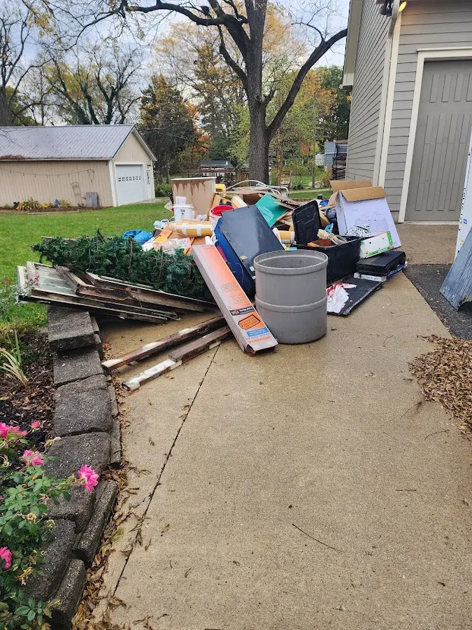 Dumpster being loaded with debris for Commercial Dumpster Rental in Silver Hill